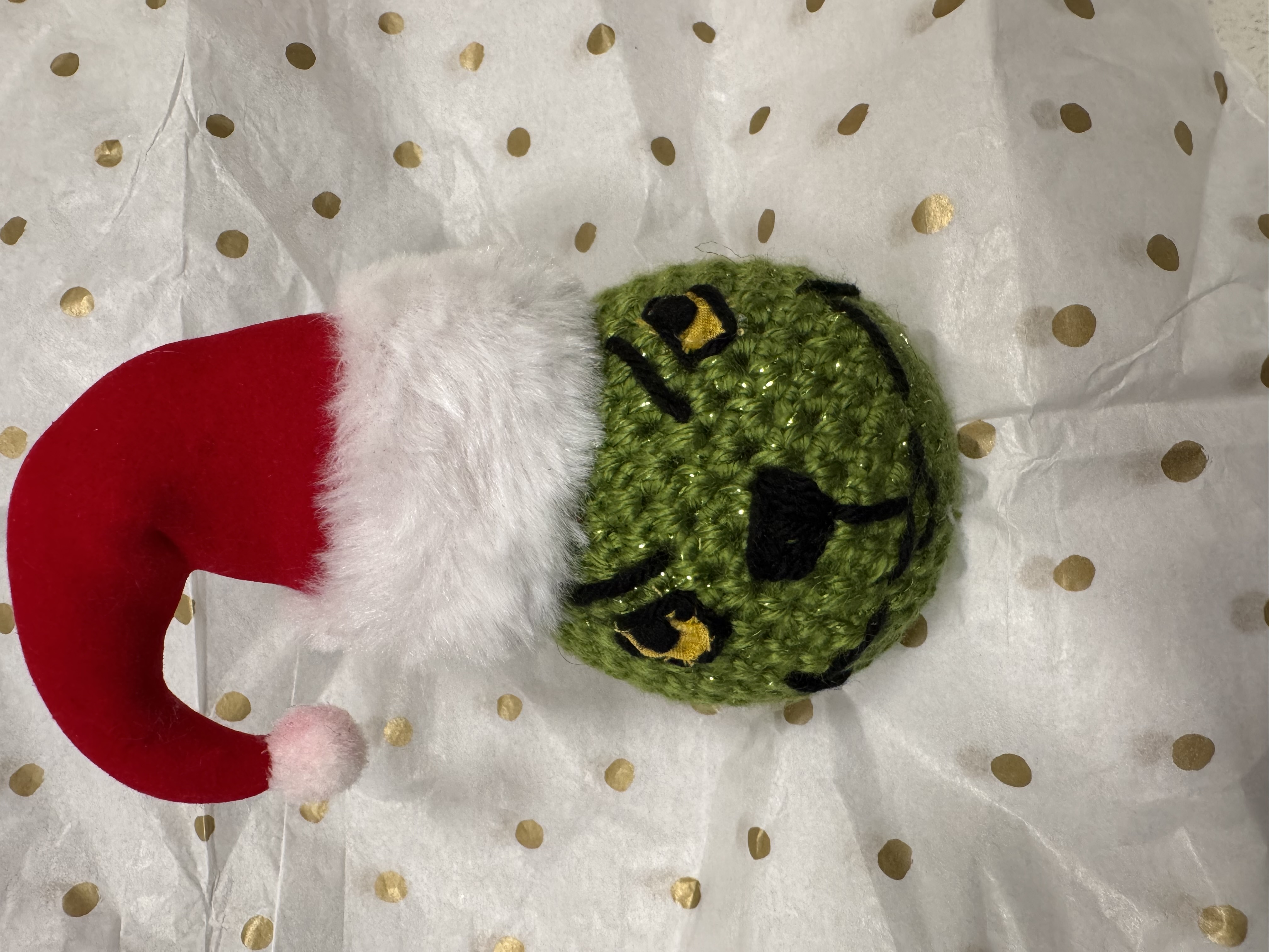 Green ornament with face